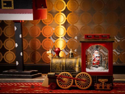 a toy train with a santa claus in it at Kempinski Residences Guangzhou - Free shuttle between hotel and Exhibition Center during Canton Fair & Exhibitor registration Counter in Guangzhou