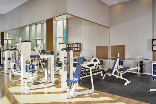 a gym with several treadmills and chairs in it at Paragraph Resort & Spa Shekvetili, Autograph Collection in Shekvetili