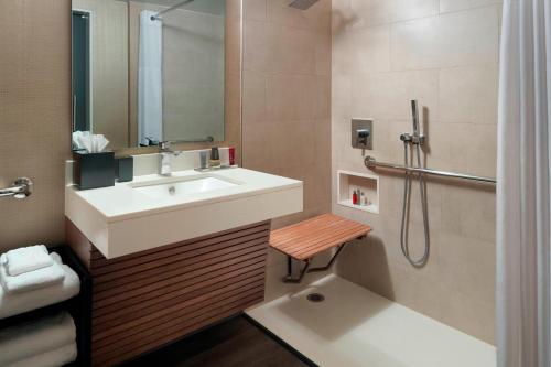 a bathroom with a sink and a shower at Charlotte Marriott City Center in Charlotte