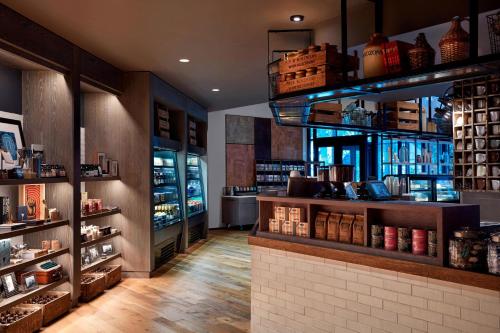 a shop with a shelf of books and a counter at Charlotte Marriott City Center in Charlotte