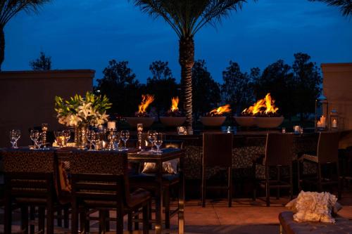 a table set up for a party with flames in the background at Renaissance Baton Rouge Hotel in Baton Rouge