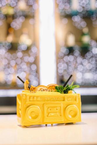 a toy yellow toy car sitting on a table at Aloft Boston Seaport District in Boston