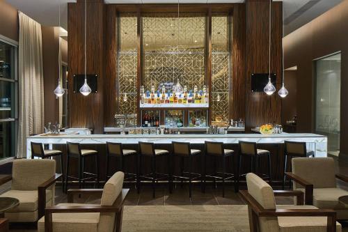 a bar in a restaurant with chairs and a counter at Residence Inn by Marriott Nashville Downtown/Convention Center in Nashville