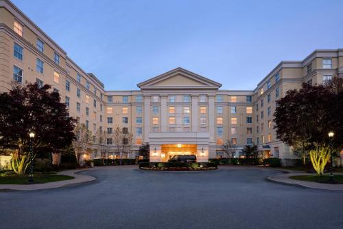 a large building with a driveway in front of it at Mystic Marriott Hotel and Spa in Groton