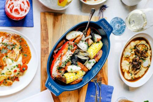 a table with a bowl of food and a plate of food at Mystic Marriott Hotel and Spa in Groton