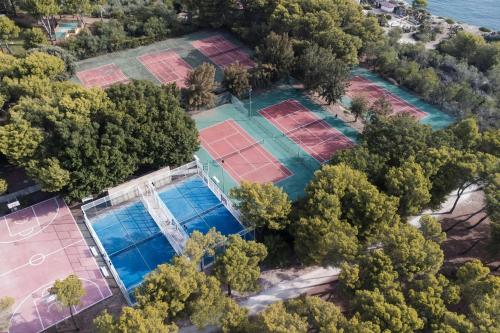 an aerial view of an estate with tennis courts at Mangia's Brucoli, Sicily, Autograph Collection in Brucoli