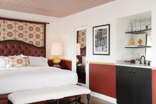 a bedroom with a bed and a sink at Casa Laguna Hotel & Spa in Laguna Beach