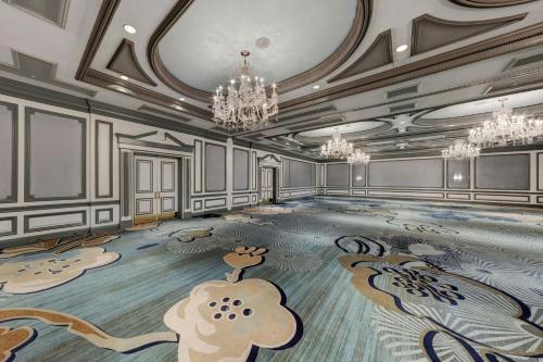 a swimming pool with a painting on the floor at The Henry, Autograph Collection in Dearborn