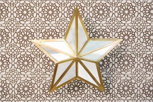 a gold star hanging on a wall at Casa Laguna Hotel & Spa in Laguna Beach