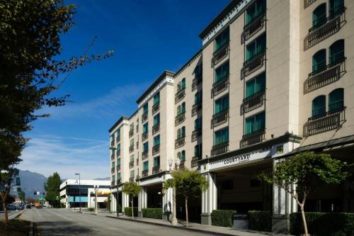 a large white building on the side of a street at Courtyard by Marriott Los Angeles Pasadena Old Town in Pasadena