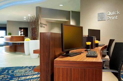 an office with a desk with a computer on it at Courtyard Denver South Park Meadows Mall in Centennial