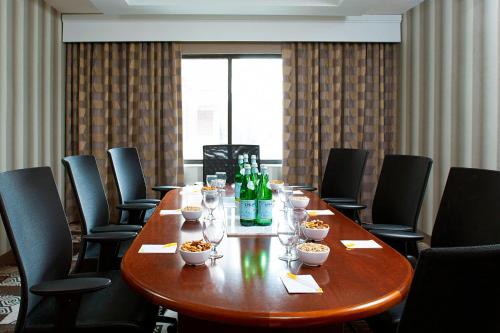 a conference room with a table with bottles and glasses at Courtyard Denver South Park Meadows Mall in Centennial
