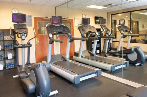 a gym with three tread machines in a room at Courtyard Denver South Park Meadows Mall in Centennial