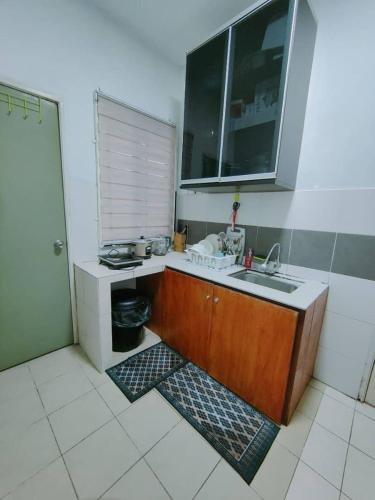 a kitchen with a sink and a counter top at FZHomestays in Cameron Highlands in Cameron Highlands