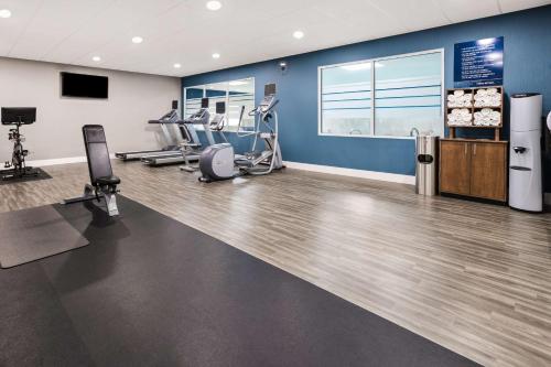 a gym with treadmills and machines in a room at Hampton Inn & Suites Hershey in Hershey