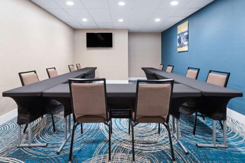 a conference room with a black table and chairs at Hampton Inn & Suites Hershey in Hershey
