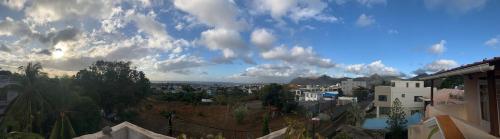 a view of a city under a cloudy sky at Luxurious house at Coromandel in La Rotraite