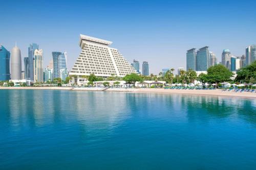 a view of a city with a beach and buildings at Sheraton Grand Doha Resort & Convention Hotel in Doha
