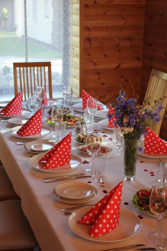 a long table with red polka dot napkins on it at Kipi-Koovi Holiday Centre in Kipi