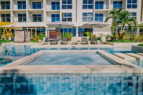 a swimming pool in front of a hotel at Radisson Riviera Panama in Punta Chame