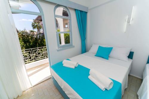 Postel nebo postele na pokoji v ubytování Kemer Royal Beach