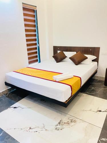 a bed sitting in a room with at Tea vista holiday home in Kalpetta