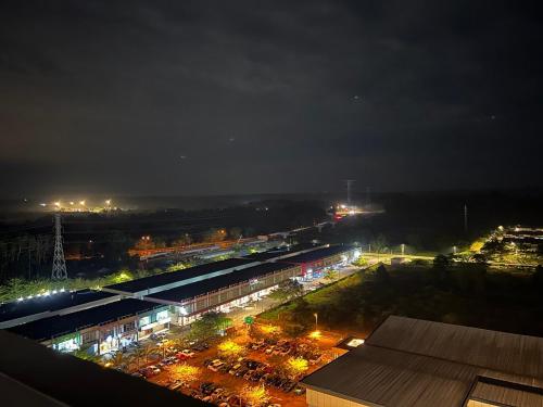 a view of a train station at night at Ancozy Desaru Luxury and Comfort Homestay in Bandar Penawar