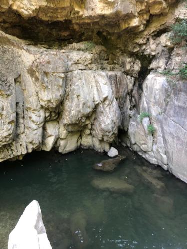 a cave filled with water next to some rocks at La Casa di Lea in Santa Fiora