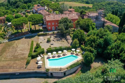 an aerial view of an estate with a swimming pool at Sweet Hills in Libbiano