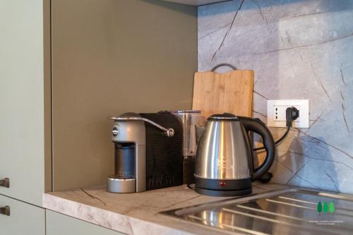 a kitchen counter with a toaster and a coffee maker at Sweet Hills in Libbiano