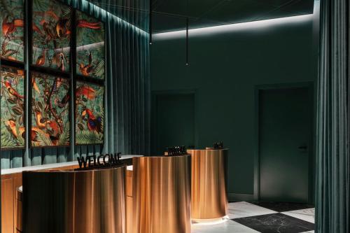 a room with a row of podiums and a painting at W Budapest in Budapest