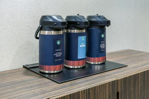 three batteries sitting on top of a shelf at Courtyard by Marriott Buffalo Downtown/Canalside in Buffalo