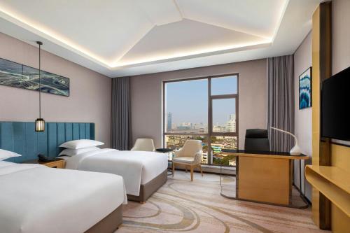 Katil atau katil-katil dalam bilik di Courtyard by Marriott Nanchang