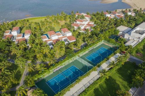 an aerial view of a resort with two swimming pools at Renaissance Danang Hoi An Resort & Spa in Hoi An