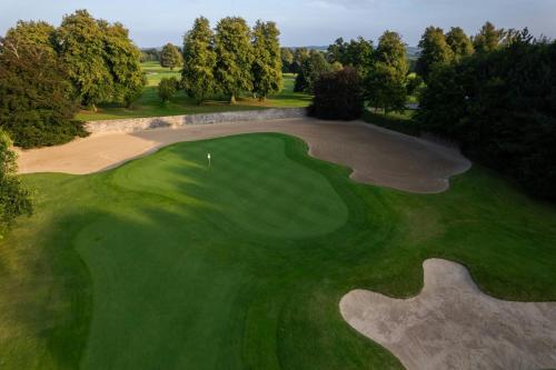 an aerial view of a golf course with a green at Mount Juliet Estate, Autograph Collection in Thomastown
