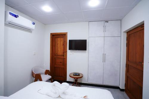 Ένα ή περισσότερα κρεβάτια σε δωμάτιο στο Luxvill Hotel
