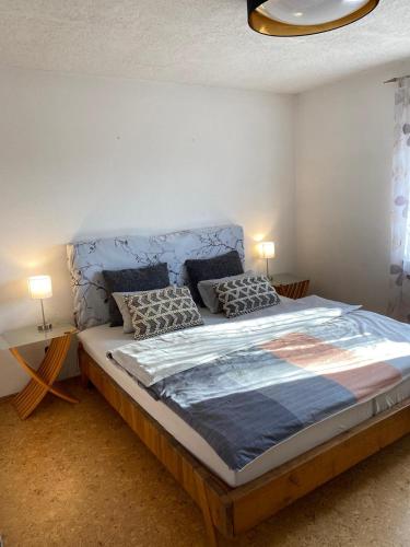 a bedroom with a large bed with two pillows at Casa Pippi Lotta in Gießen