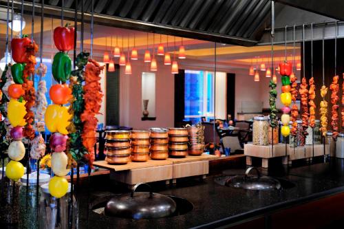 a restaurant with a buffet with a bunch of balloons at Courtyard By Marriott Kuwait City in Kuwait