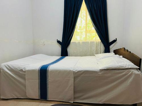 Postel nebo postele na pokoji v ubytování Meeyan Ella Rest