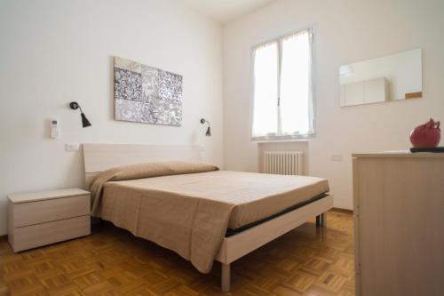 Ένα ή περισσότερα κρεβάτια σε δωμάτιο στο Casa Damiano