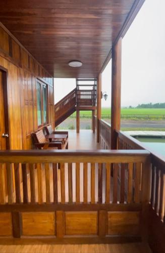 a view from the balcony of a house at Ruen Singhanat Cafe & Resort in Ban Lum Thonglang (2)