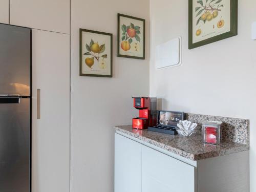 a kitchen with a counter with a coffee maker on it at Borgo Tabari Locazione Turistica in Mussolente 