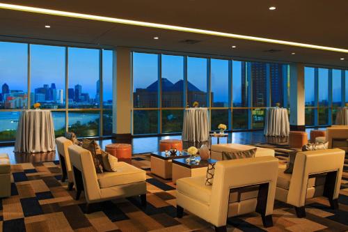 a large living room with a view of the city at Renaissance Dallas Hotel in Dallas