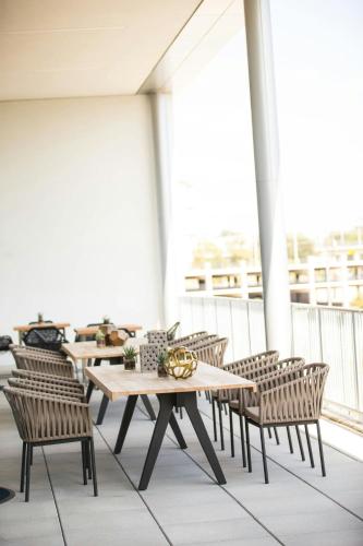 a row of tables and chairs on a balcony at Renaissance Dallas Hotel in Dallas