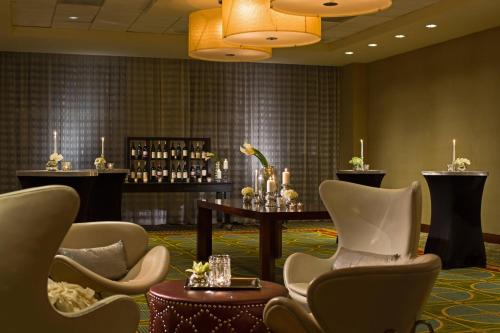 a waiting room with chairs and a table with candles at Renaissance Las Vegas Hotel in Las Vegas
