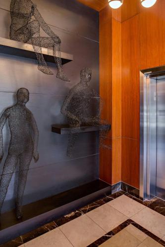 two statues of men on a wall in a museum at Renaissance Las Vegas Hotel in Las Vegas