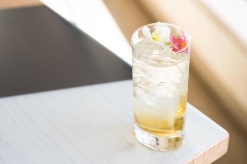 a drink in a glass sitting on a table at Westdrift Manhattan Beach, Autograph Collection in Manhattan Beach
