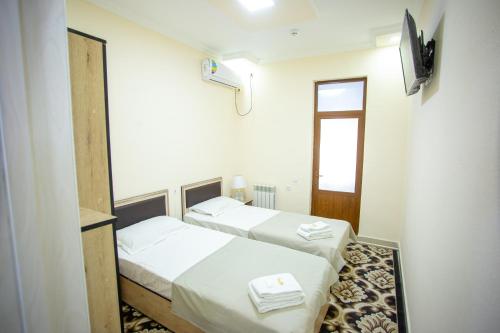 Postel nebo postele na pokoji v ubytování Tiny House Hotel