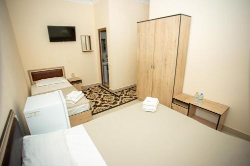 Postel nebo postele na pokoji v ubytování Tiny House Hotel