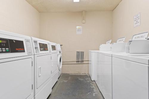 a laundry room with white machines on display at Perdido Sun 304 in Perdido Key